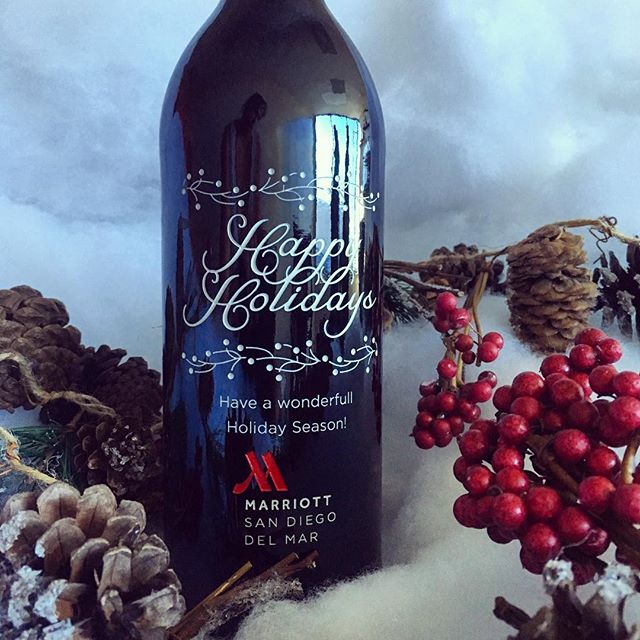 Happy Holidays company holiday gift engraved wine bottle with company logo