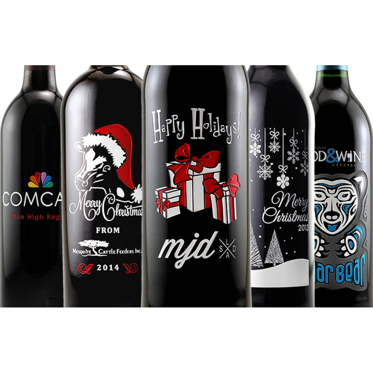 Five custom etched Happy Holidays wine gift bottles