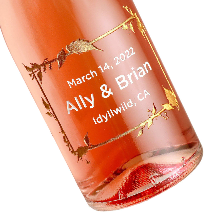 Case of etched mini rose wine wedding favors with floral frame design by Etching Expressions