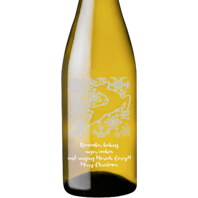 Holiday Reindeer design on an etched white wine bottle by Etching Expressions