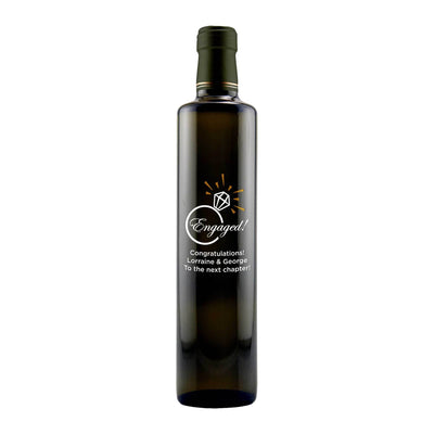 Engaged! with a diamond graphic etched on an olive oil bottle engagement gift by Etching Expressions